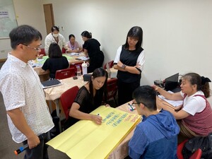 Participants developing plans for marine education activities through group discussions